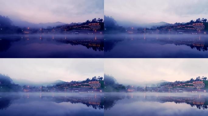 雾在早晨在泰国湄宏顺的ban rak泰国华人村的池塘上移动。(时间流逝)