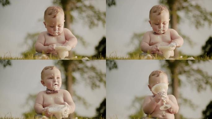 一岁生日的小孩拿着冰淇淋。