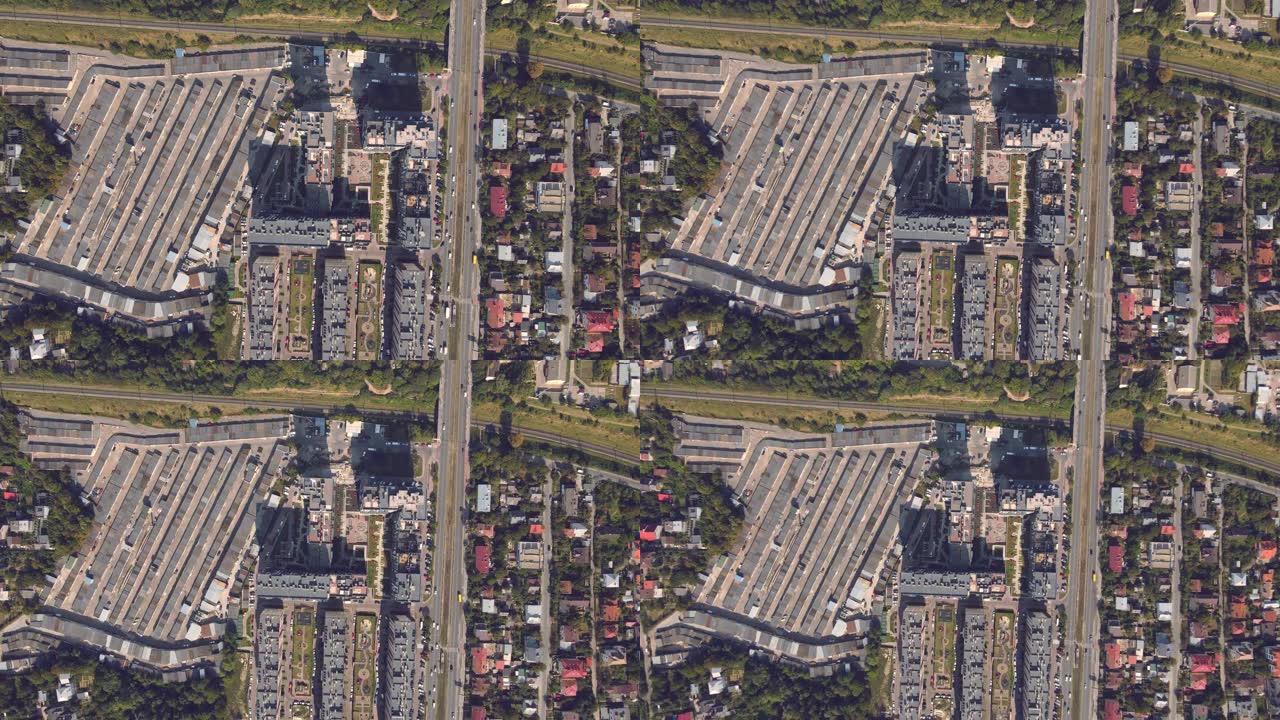 从高处俯瞰城市顶部和街道。城市和房屋，街道和汽车从500米的高度。