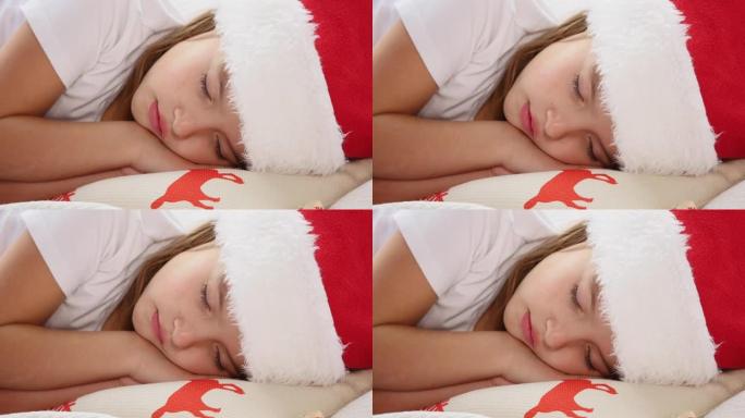 在圣诞树旁，一个美丽的睡着的孩子像天使一样躺在白色的毯子上。