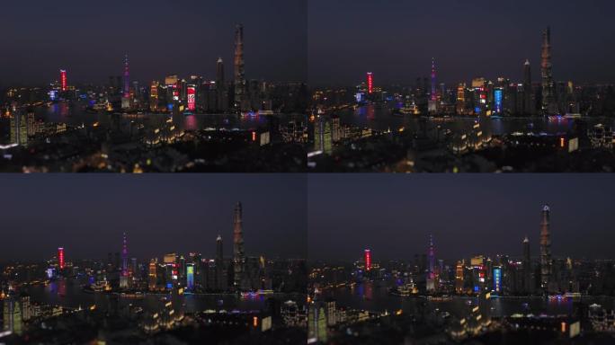 夜间照明上海著名的浦东市区航空全景4k倾斜移位中国