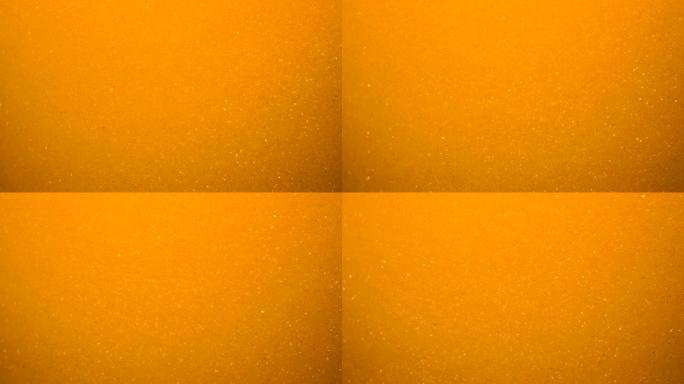 金波背景。艺术黄金背景。金色的沙子，灰尘创造了抽象的云层。慢动作。金色质地。惊人的变态闪耀闪亮粒子与