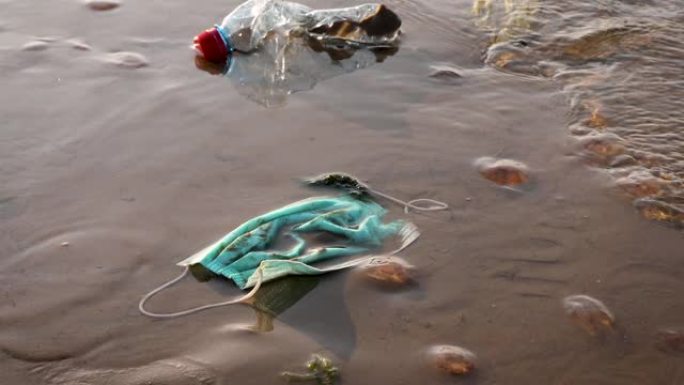 沿海地区的医用口罩，自冠状病毒新型冠状病毒肺炎大流行以来的塑料废物污染
