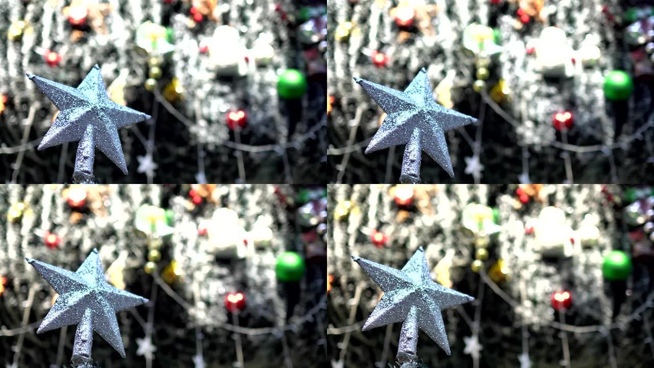 白天圣诞树上的明星装饰特写。在假日市场。模糊的背景是圣诞装饰品。