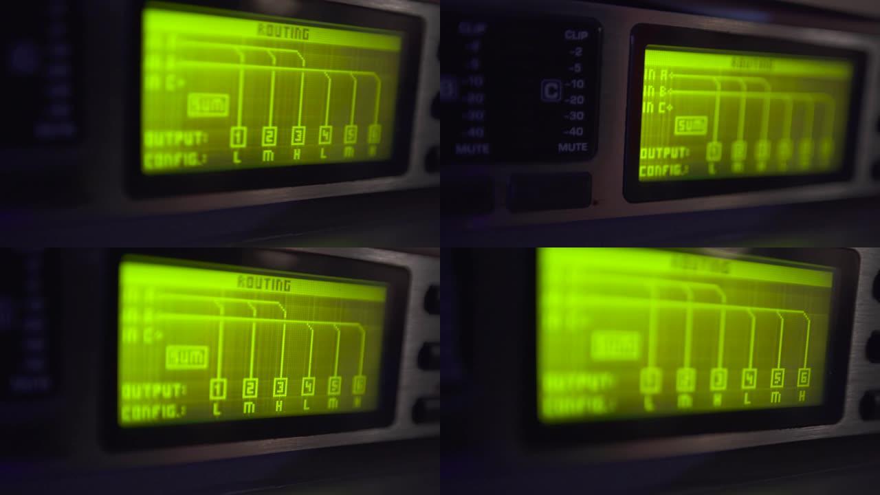 关闭专业音频设备数字音箱上的路由绿光屏幕。屏幕上的水平，面板上的按钮。