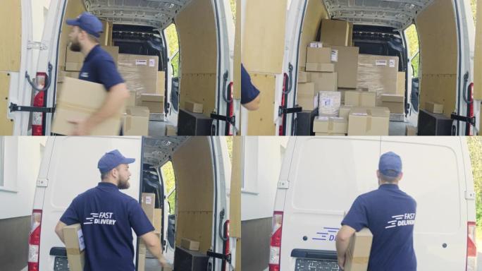 带纸箱的年轻送货员