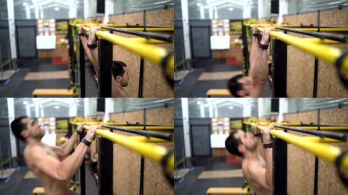 Man Doing Pull Ups in Gym