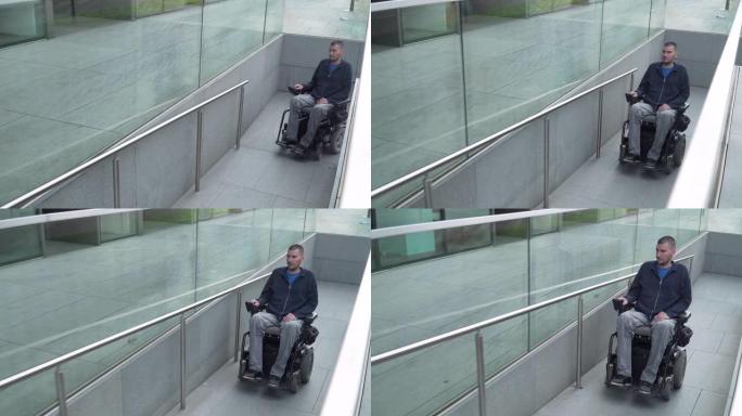 4k分辨率跟随一个坐在电动轮椅上的人使用坡道。无障碍概念