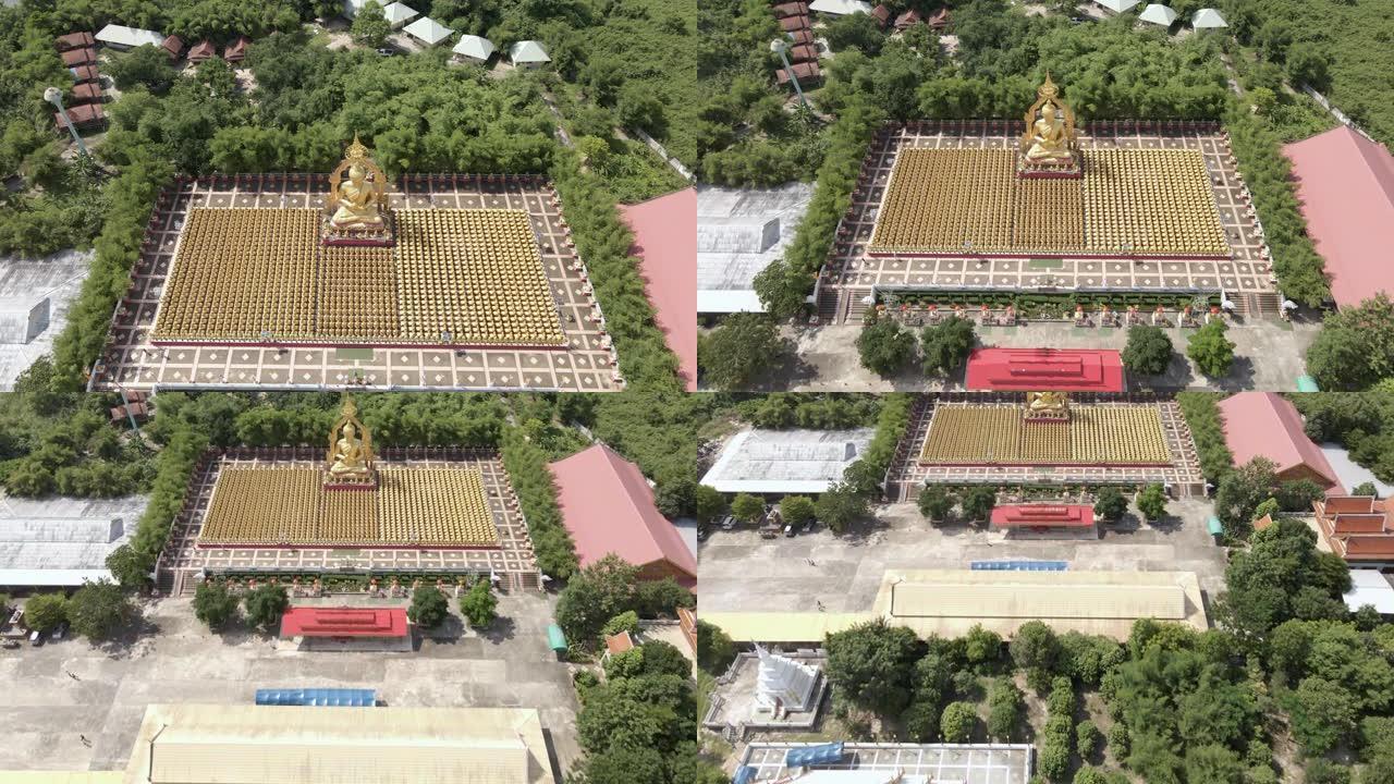 鸟瞰图大金佛像和许多小金佛像排成一排。泰国nakornayok省的寺庙。