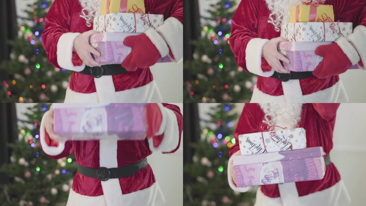 穿着圣诞老人服装的白人老人在新年树前向相机赠送礼物。拿着礼品盒的人。节日快乐、传统、圣诞节的概念。