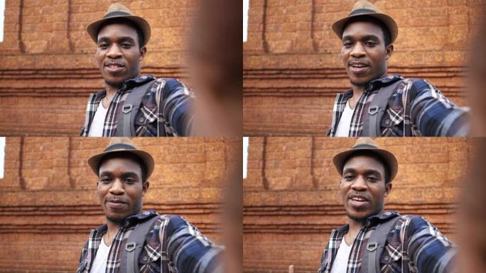 快乐的非洲裔美国人Vlog看着相机谈论旅行视频呼叫激励远方朋友