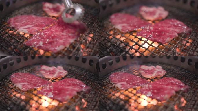 4k日式烤牛肉，新鲜的红色生肉，煤火，日本餐厅，巨大的午餐，营养蛋白脂肪，烧烤架，火焰烤，与家人共进