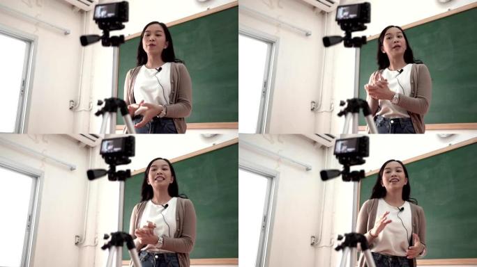 亚洲女教师在课堂上进行站立教学和在线演讲
