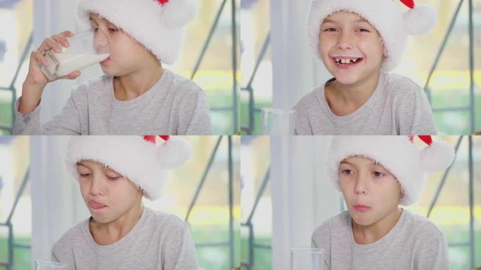 裁剪4k视频，小男孩戴着圣诞老人帽子喝牛奶，吃美味的饼干，舔牛奶胡子。