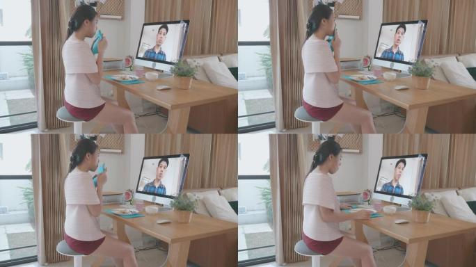 东南亚人在家庭检疫期间一起吃虚拟晚餐