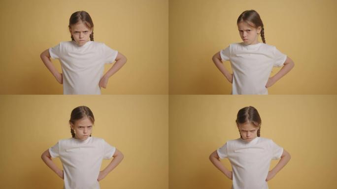 女孩表现出拒绝手势不，在黄色墙壁慢动作中摇摇头