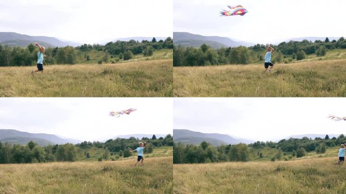 男孩奔跑并在山中发射一条蛇风筝