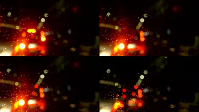 汽车在雨夜在城市交通中行驶。汽车，夜晚，下雨，小心