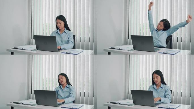 年轻的亚洲女性坐在办公室时伸展肌肉，以减轻压力。