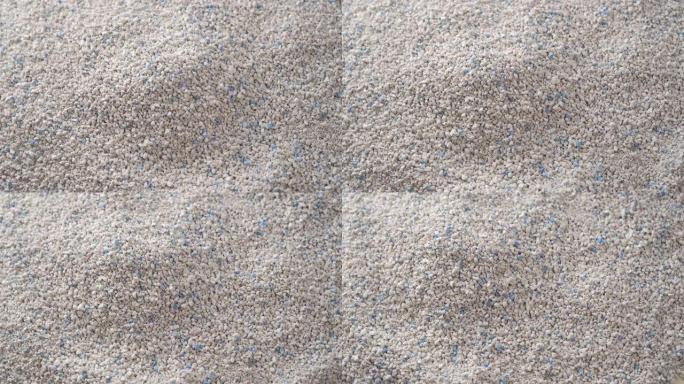 猫砂。用于卫生和气味消除的堆吸收物质