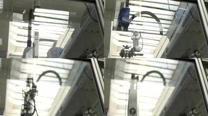 现代机器在玻璃后面制造