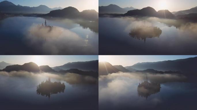 鸟瞰图的布莱德岛(布莱斯基otok)与朝圣教堂的圣母升天在湖流血在晴朗的秋天早晨与轻雾，斯洛文尼亚