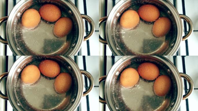 鸡蛋在水中煮沸。将产品放在燃气灶上。烹饪，准备
