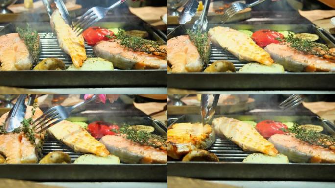 烤鱼，烤三文鱼排，鸡肉，芳香香料和烤蔬菜排，用叉子翻转，特写，4k
