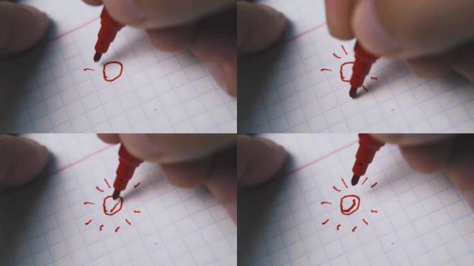 男子在空白方格纸上使用红色记号笔绘制太阳