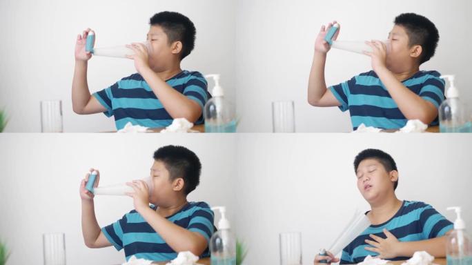 亚洲男孩服用哮喘吸入器有助于在家呼吸，健康和医学概念。