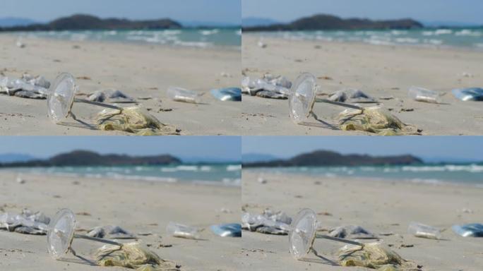 塑料和吸管被冲走，埋在海边的沙子里。