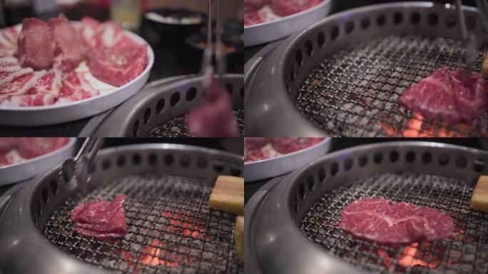 4k日式手拿牛肉片放在烧烤架上，做得很好，中等稀有肉，煤火，日本餐厅，午餐，火焰烤，白盘，餐厅主菜