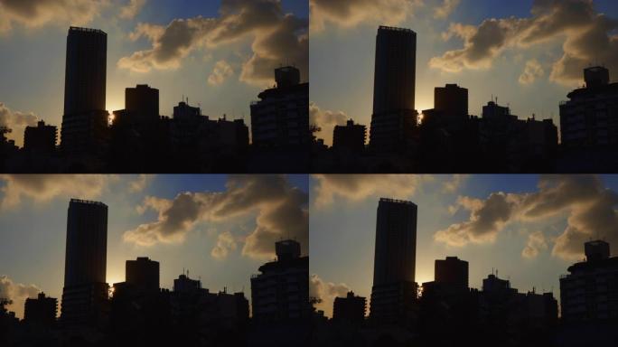 建筑物之间有日落的城市蓝天