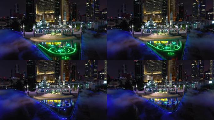 吉隆坡市中心著名的生命湾河穿越夜间照明展示航空全景4k马来西亚