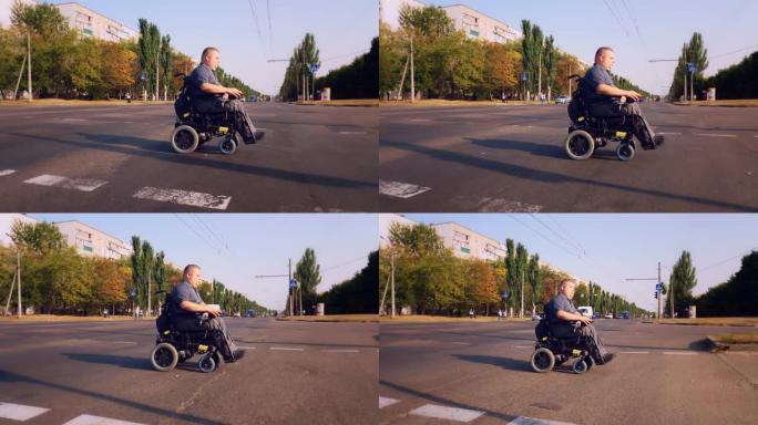轮椅男子。残疾人。一名坐在自动轮椅上的年轻残疾人在人行横道过马路