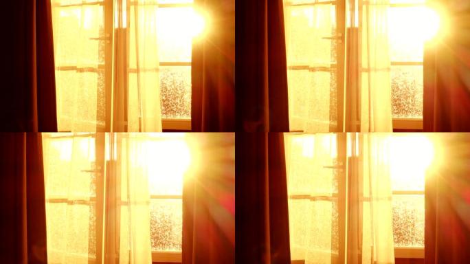 阳光透过打开窗户的透明窗帘，在美丽的红日映照下，微风轻拂