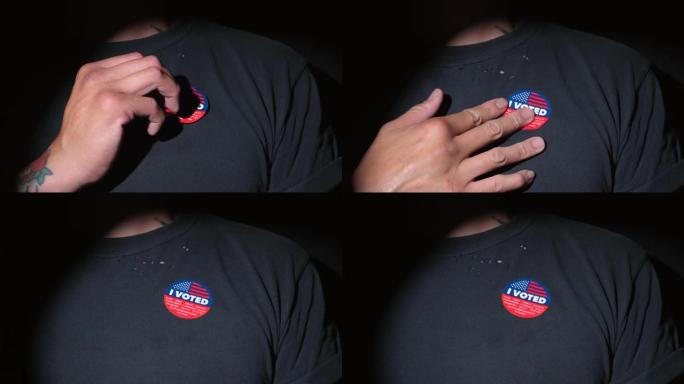 特写的人把我的投票标签贴在衬衫上