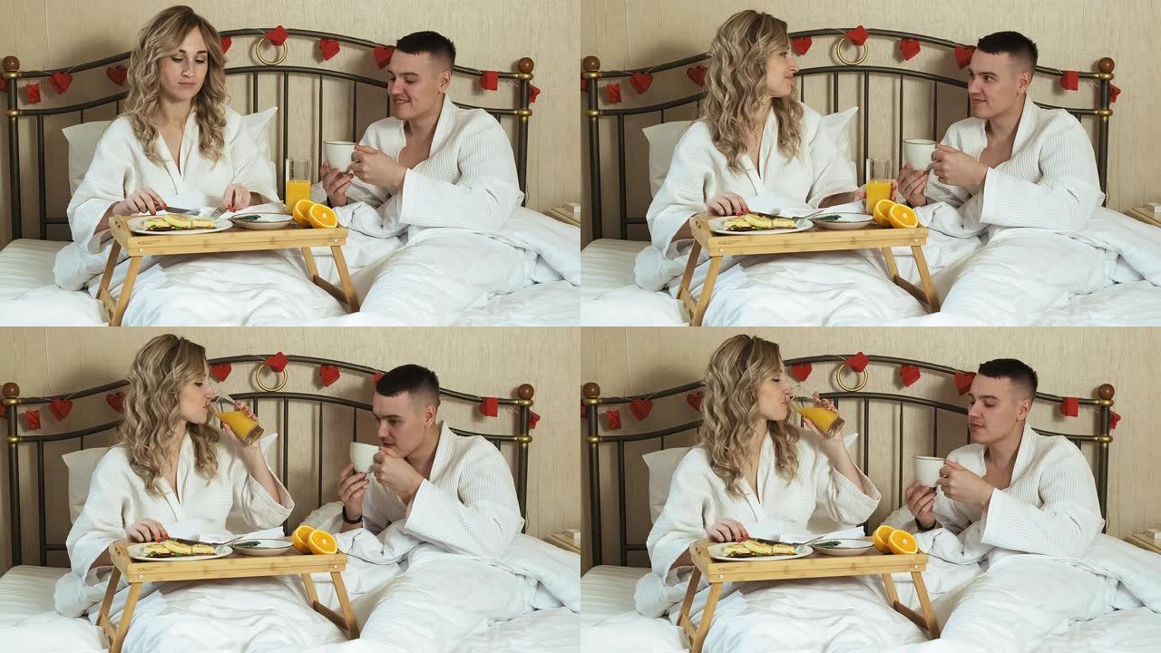 年轻情侣情侣床上浪漫早餐