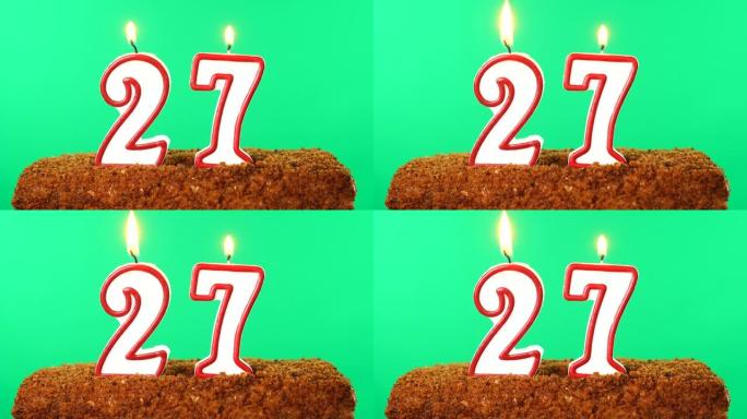 27号点燃蜡烛的蛋糕。色度键。绿屏。隔离