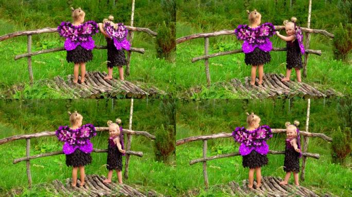 蝴蝶翅膀的女孩站在木桥上