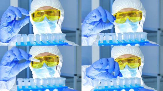 科学家穿着防护服的特写镜头，检查实验室试管中的危险材料。