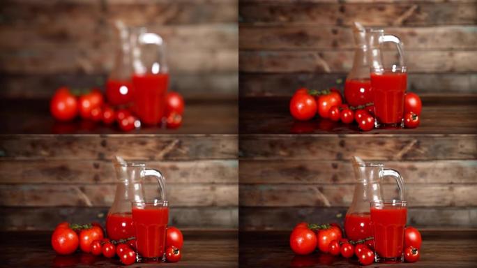 桌上的玻璃杯和水罐中的番茄汁。