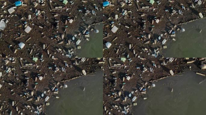 空中无人机视点滨水废料-堆塑料瓶垃圾污染海洋垃圾户外，环境生态自然灾害引起的人类活动概念