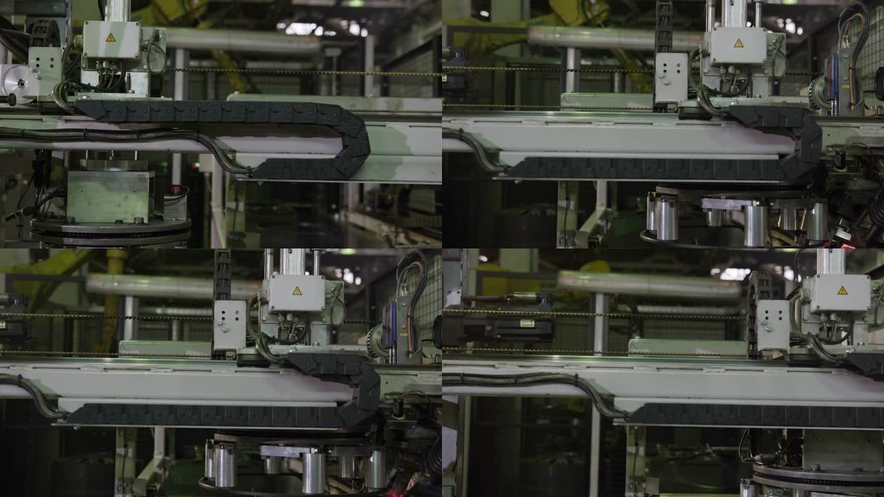 机器将轮胎轮辋转移到工厂特写镜头中进行标记