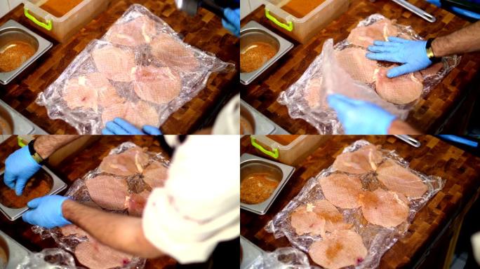 烹饪。特写镜头。一位戴着防护手套的男厨师正在用鸡排做排骨。为顾客准备食物。健康食品。志愿服务和慈善机