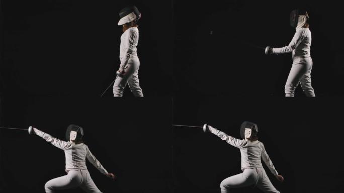 一名年轻女子的侧视图一名击剑运动员戴上面具，向前冲刺，进入战斗位置。黑色背景。慢动作。特写