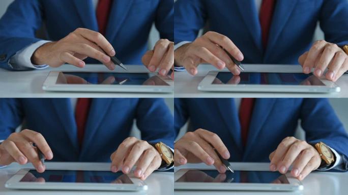 手握笔的商人使用带有商业报告的数字平板电脑