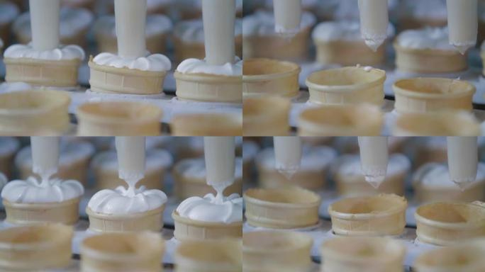 冰淇淋生产线的特写镜头。冰淇淋厂用冰淇淋填充威化杯