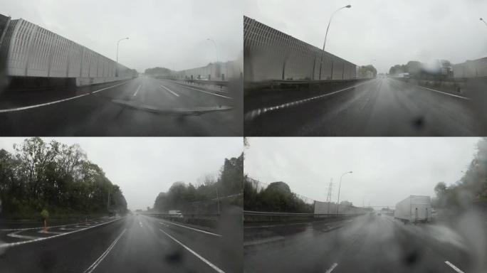 雨天开车。大雨中的交通，高速公路上的交通。镜头上的雨滴