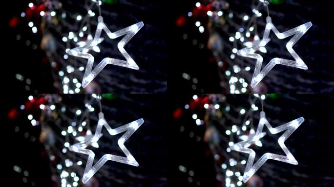 挂在树上的led灯。这个形状看起来像一颗星星。晚上。主题在右边。